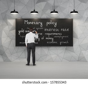 Businessman Writing About Monetary Policy