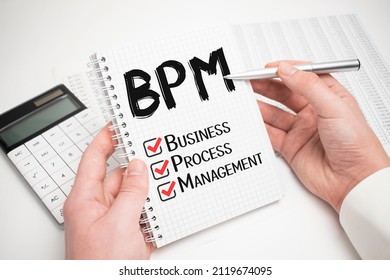 Businessman Writing BPM Concepts On His Note