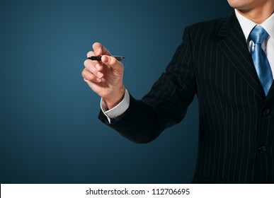 Businessman writing, drawing on the screen - Powered by Shutterstock