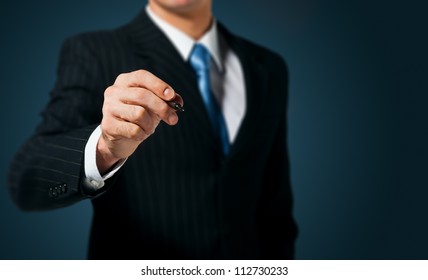 Businessman writing, drawing on the screen - Powered by Shutterstock