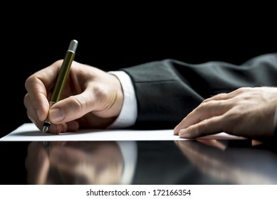 Businessman writing a letter, notes or correspondence or signing a document or agreement, close up view of his hand and the paper - Shutterstock ID 172166354
