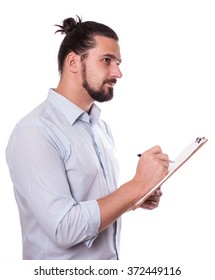 Businessman Writing On A Clipboard, Isolated. Young Man  With Hair Bun. Stock Image