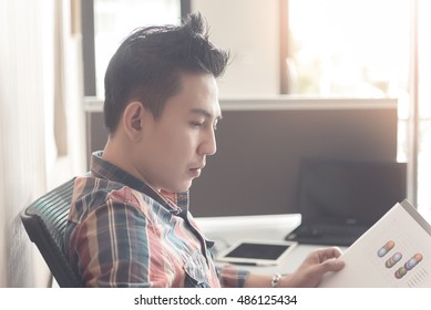 Businessman young distant future are to test the effectiveness of inspection itself with bright sunlight,handsome,smart - Shutterstock ID 486125434