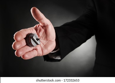 Businessman's Hand With A Hand Buzzer