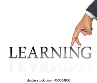 Businessman's hand as finger walking on Learning word