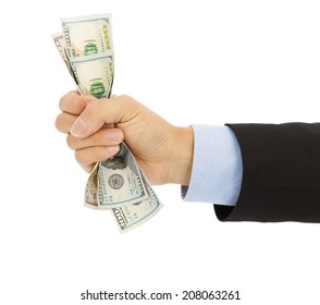 Businessman's Hand Grasping A Handful Of Dollars
