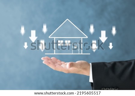 Businessman's hand and house illustration with downward arrows
