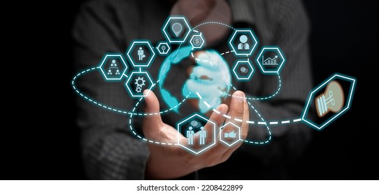 Businessman's Hand Show The Concept Of Business Technology In The Communication World And Work Together As An Organization Through World-class Technology.