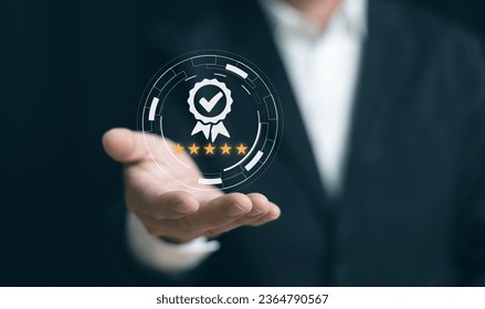 Businessman's hand showing symbolic icon of top service. Quality Assurance, Guarantees, standards, ISO certification and standard concepts, satisfaction, and service experiences. - Powered by Shutterstock