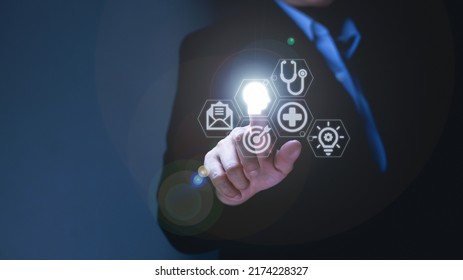 Businessman's Hand Touches Virtual Man's Head Button. Idea. Spark Business Idea. Business Goals And Achievements With New Concept Copy Space.