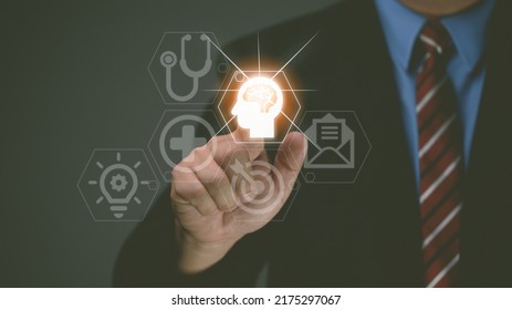 Businessman's Hand Touches Virtual Man's Head Button. Idea. Spark Business Idea. Business Goals And Achievements With New Concept Copy Space.