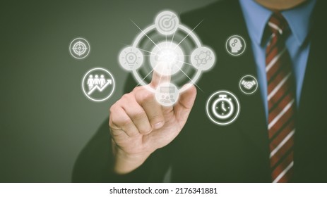 Businessman's Hand Touches Virtual Man's Head Button. Idea. Spark Business Idea. Business Goals And Achievements With New Concept Copy Space.