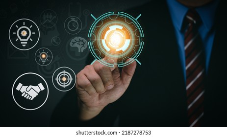 Businessman's Hand Touches Virtual Man's Head Button. Idea. Spark Business Idea. Business Goals And Achievements With New Concept Copy Space.