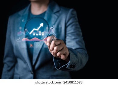 A businessman's hand touches a virtual screen, revealing stock market data analysis icons. This digital interaction offers a glimpse into the modern era of financial analysis and market insights
