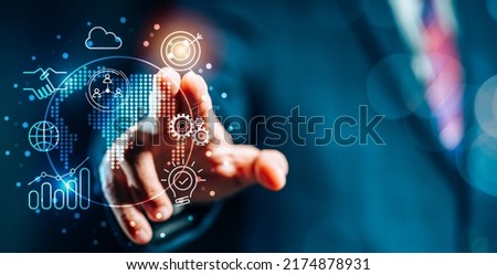 Businessman's hand and Virtual Screen icons display digital marketing, financial, banking and big data. Global Management Technology