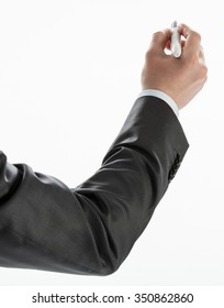 Businessman's Hand Writing Something On A White Wall