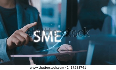 Businessman's hands touch a virtual screen, revealing trends in small businesses, SMEs, business expansion, improving economy, and areas of investment from venture capitalists