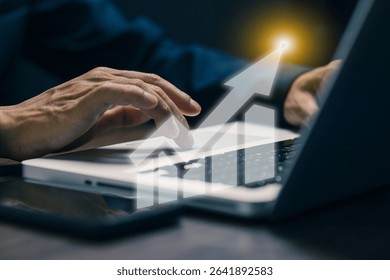 Businessman's hands typing on laptop keyboard with upward arrow growth graph overlay, symbolizing digital marketing success, business analytics, and online financial growth.