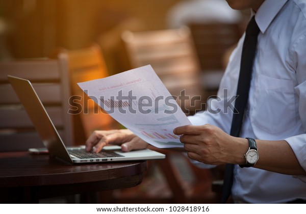 Businessman\'s Key Research and  Auditing Income\
Statement Data From Excel  SPREADSHEETS. Audit Making Database\
Report Financial Planning Report in Cafe in Park Near the Office\
Before Entering\
Meeting