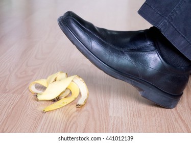 businessman's shoes stepped on a banana 