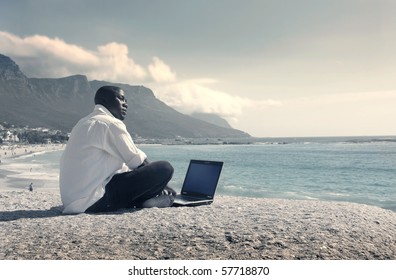 a businessman's working on the beach
