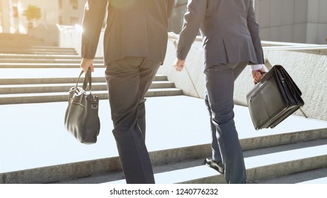 Businessmen Approaching Office Building, Climbing Stairs, Optimistic Outlook