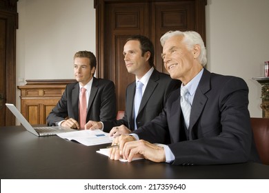 Businessmen In Board Meeting