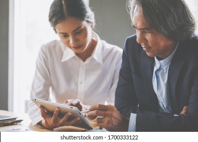 businessmen brainstorming for strategy of business investment,businessmen review chart and document  - Shutterstock ID 1700333122
