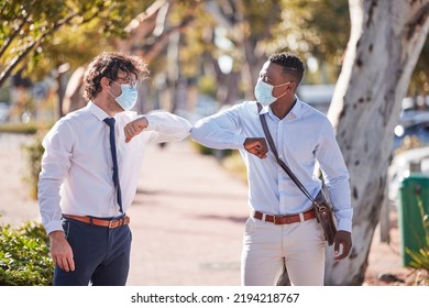 Businessmen Elbow Greeting In Covid 19 Masks Outside In A Parking Lot Showing Teamwork And Diversity In Summer. Sun, World And Social Safety Protocol By People Who Work For A Global Corporate