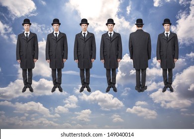 businessmen floating over blue sky with clouds, magritte style - Powered by Shutterstock