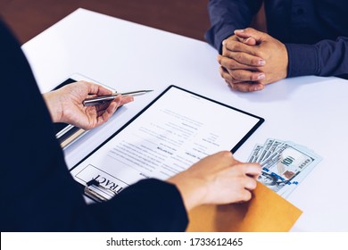 Businessmen give dollars to bribe employees in signing contracts to buy illegal land and real estate, Business fraud and social injustice, corruption and bribery concept. - Shutterstock ID 1733612465