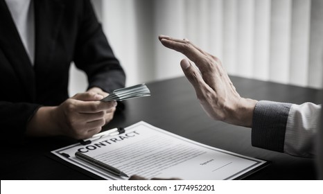Businessmen give dollars to bribe employees in signing contracts to buy illegal land and real estate, Business fraud and social injustice, Anti Bribery and corruption concept.