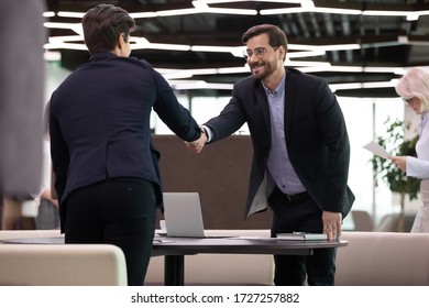 Businessmen Greeting Each Other Handshake Standing In Office Hallway Sit Down At Table Start Business Meeting. Applicant Hr Manager End Successful Job Interview, Client And Banker Appointment Concept