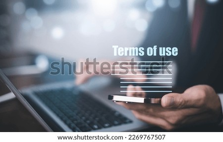 Businessmen hold smartphone of Terms of use concept, online banking check budget planning concept banner for website header design, Terms of use business concept. Terms and conditions of contract.