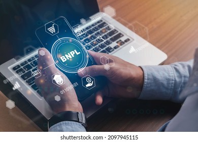Businessmen holding a smartphone with icons of  BNPL with online shopping icons technology. BNPL Buy now pay later online shopping concept. - Shutterstock ID 2097945115