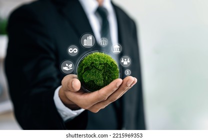 Businessmen holding world to Organization Sustainable development environmental. Sustainable business or green company Concept. business responsible environmental, social and governance.