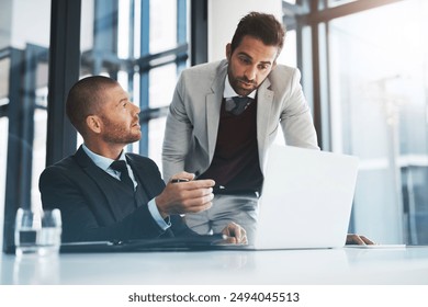 Businessmen, laptop and planning for collaboration in office, accounting agency and teamwork for project. Support, discussion and mentorship with internship, talking and problem solving for finance - Powered by Shutterstock