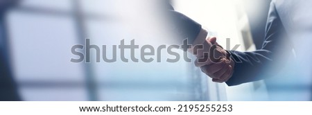 Businessmen making handshake with partner, greeting, dealing, merger and acquisition, business cooperation concept, panoramic banner, copy space for business, finance and investment background