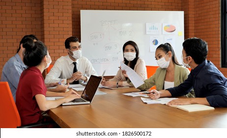 Businessmen Are Meeting Conference About Work In Meeting Room And Everyone Wear The Medical Mask For Protect Germs Or Bacteria And Covid-19.