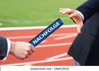 Businessmen passing blue baton in relay race with German word Nachfolge means Succession