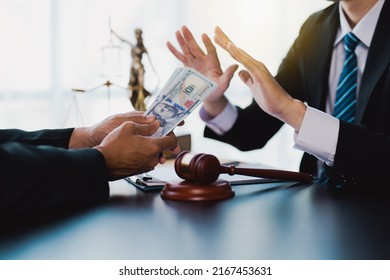 Businessmen or politicians refuse to accept bribes that are given in envelopes. To do illegal business, corruption in the contracting business, corruption concept and bribery.