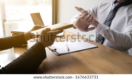 Businessmen refusing accept bribes at the office, Bribery and corruption concept.