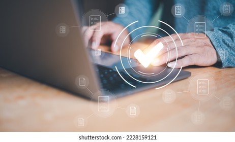 Businessmen reviewing procedures through virtual online documents, concepts on practices and policies. Articles of Association terms and conditions, check mark icon Indicates the validity of agreement - Shutterstock ID 2228159121