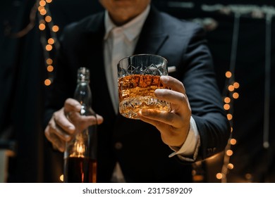 Businessmen in suits drinking  Celebrate whiskey - Powered by Shutterstock