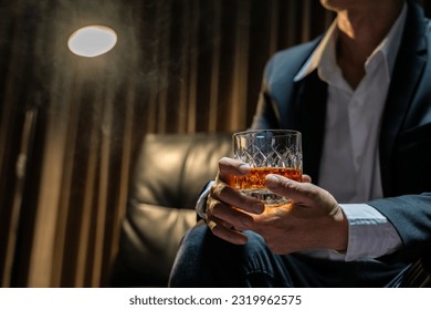 Businessmen in suits drinking  Celebrate whiskey. - Powered by Shutterstock