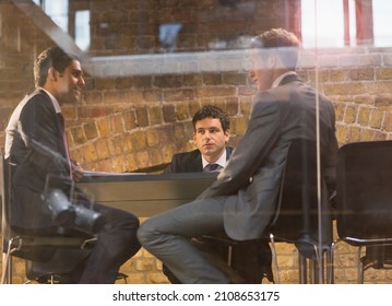 Businessmen Talking In Conference Room Meeting