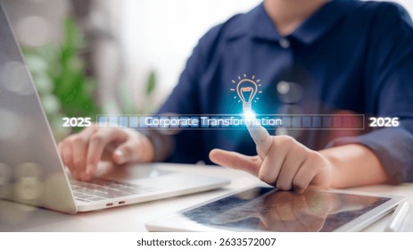 Businessmen touching the corporate transformation progress bar with a glowing light bulb icon, symbolizing innovation and digital growth from 2025 to 2026 in business development concept.