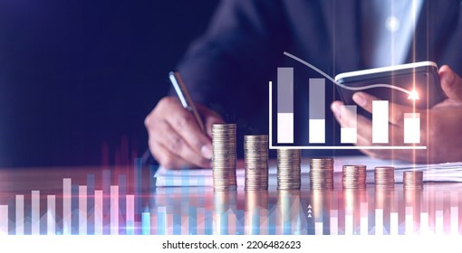 businessmen use calculators with placing coins in a growing position,Investment concepts, financial growth and saving - Shutterstock ID 2206482623