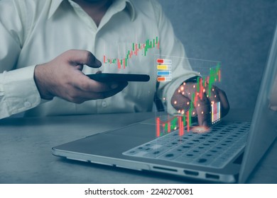Businessmen use computers and mobile phone is showing a growing virtual hologram stock in trading. Planning and strategy, progress or success concept. Business finance technology and investment. - Shutterstock ID 2240270081