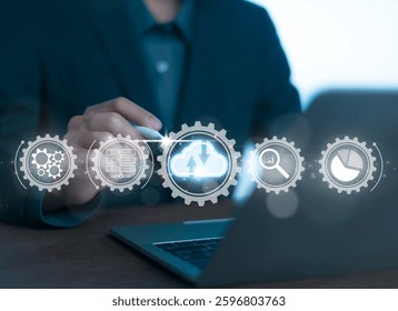 Businessmen use computers to visualize large online data in the cloud.
It is a cloud server backup platform technology to ensure the safety of business data communications and data download systems.